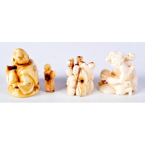 58 - A 19TH CENTURY JAPANESE MEIJI PERIOD CARVED IVORY NETSUKE together with two similar okimono. Largest... 