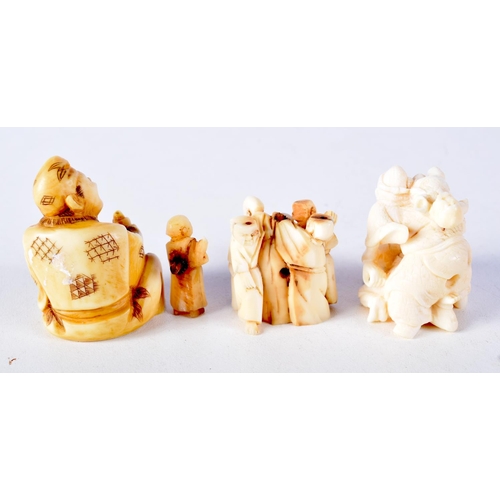 58 - A 19TH CENTURY JAPANESE MEIJI PERIOD CARVED IVORY NETSUKE together with two similar okimono. Largest... 