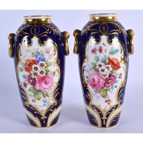 148 - ENGLISH PORCELAIN FINE PAIR OF URN SHAPED VASES WITH RING HANDLED LAVISHLY PAINTED WITH FLOWERS SURR... 