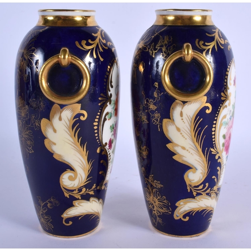 148 - ENGLISH PORCELAIN FINE PAIR OF URN SHAPED VASES WITH RING HANDLED LAVISHLY PAINTED WITH FLOWERS SURR... 