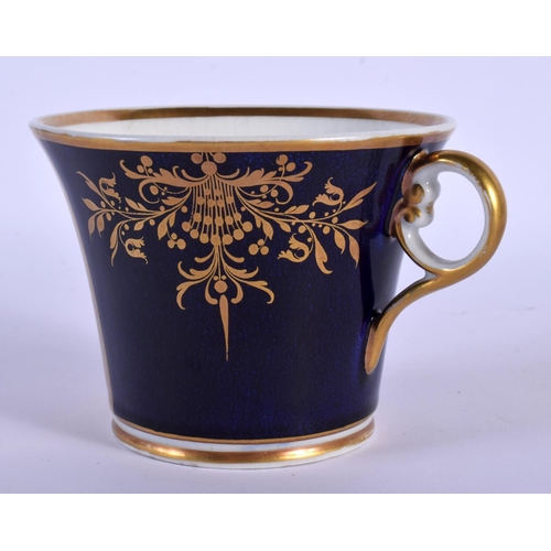 194 - CHAMBERLAIN~S WORCESTER LARGE CUP AND STAND PAINTED WITH CRANFORD BRIDGE IN A GILT PANEL ON A COBALT... 