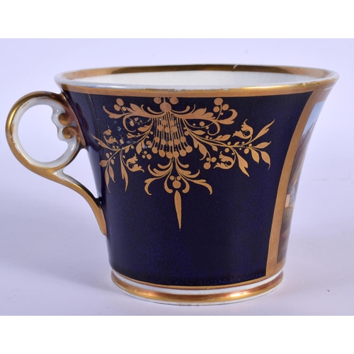 194 - CHAMBERLAIN~S WORCESTER LARGE CUP AND STAND PAINTED WITH CRANFORD BRIDGE IN A GILT PANEL ON A COBALT... 