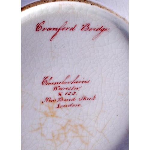 194 - CHAMBERLAIN~S WORCESTER LARGE CUP AND STAND PAINTED WITH CRANFORD BRIDGE IN A GILT PANEL ON A COBALT... 