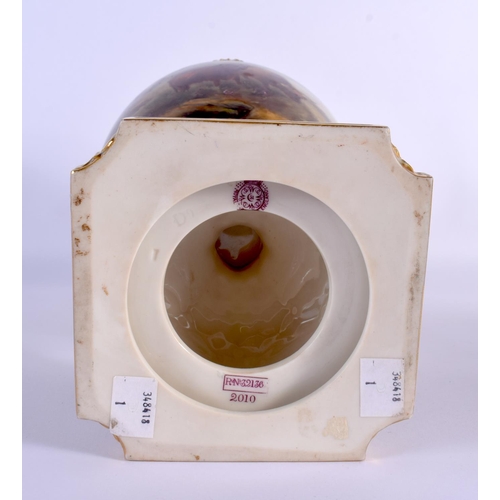 217 - A LARGE ROYAL WORCESTER TWIN HANDLED PORCELAIN VASE by John Stinton, painted with highland cattle wi... 