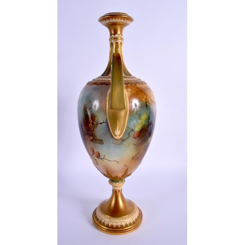 219 - A LARGE ROYAL WORCESTER TWIN HANDLED PORCELAIN VASE by Lewis, painted with game birds within landsca... 