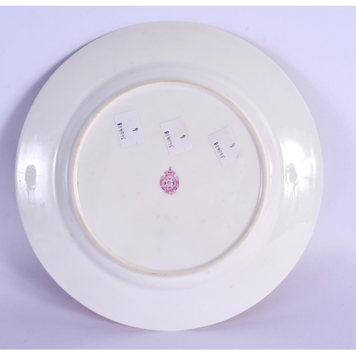 220 - A ROYAL WORCESTER PORCELAIN CABINET PLATE by Ernest Barker, painted with sheep. 22 cm diameter.