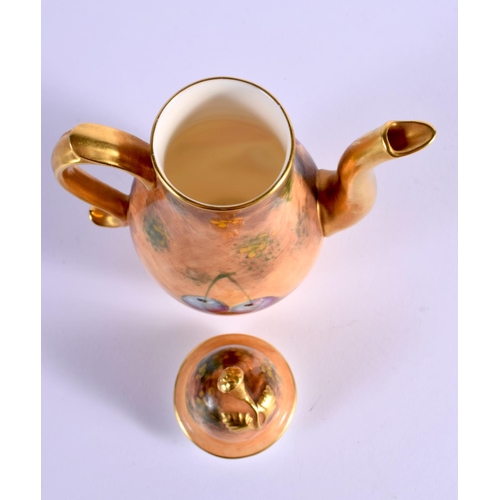 221 - A SMALL ROYAL WORCESTER FRUIT PAINTED COFFEE POT AND COVER with scrolling handle. 137 cm x 7 cm.
