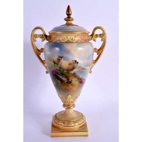 223 - A ROYAL WORCESTER TWIN HANDLED PORCELAIN VASE AND COVER by Harry Davis, painted with two sheep withi... 