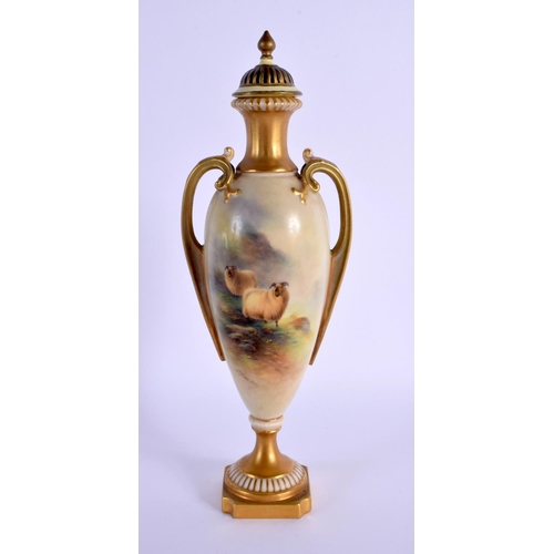 224 - A ROYAL WORCESTER TWIN HANDLED PORCELAIN VASE AND COVER by Ernest Barker, painted with sheep within ... 