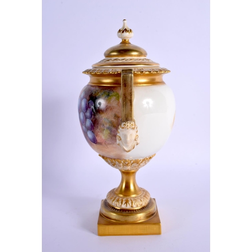 225 - A ROYAL WORCESTER FRUIT PAINTED TWIN HANDLED VASE AND COVER by Telford. 21 cm x 8 cm.