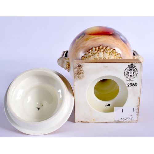 225 - A ROYAL WORCESTER FRUIT PAINTED TWIN HANDLED VASE AND COVER by Telford. 21 cm x 8 cm.