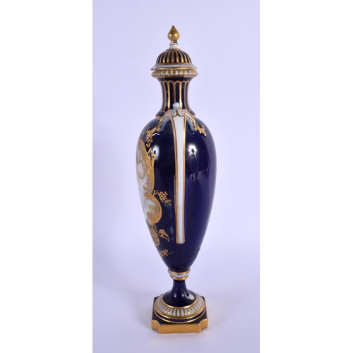 231 - A ROYAL WORCESTER TWIN HANDLED VASE AND COVER by Harry Davis, painted with a Scottish scene. 24 cm h... 