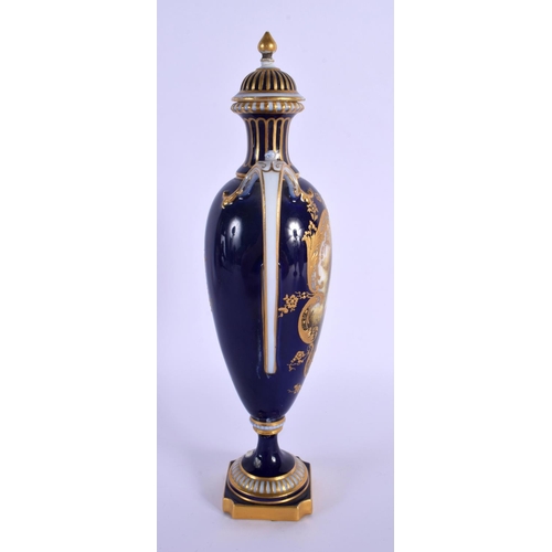 231 - A ROYAL WORCESTER TWIN HANDLED VASE AND COVER by Harry Davis, painted with a Scottish scene. 24 cm h... 