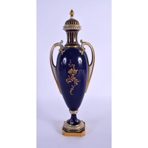 231 - A ROYAL WORCESTER TWIN HANDLED VASE AND COVER by Harry Davis, painted with a Scottish scene. 24 cm h... 