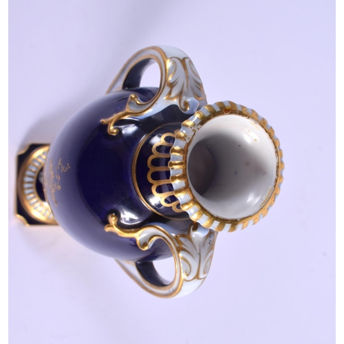 231 - A ROYAL WORCESTER TWIN HANDLED VASE AND COVER by Harry Davis, painted with a Scottish scene. 24 cm h... 