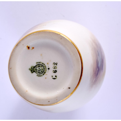 235 - A ROYAL WORCESTER PORCELAIN VASE by Harry Davis, painted with sheep within landscapes. 14 cm high.