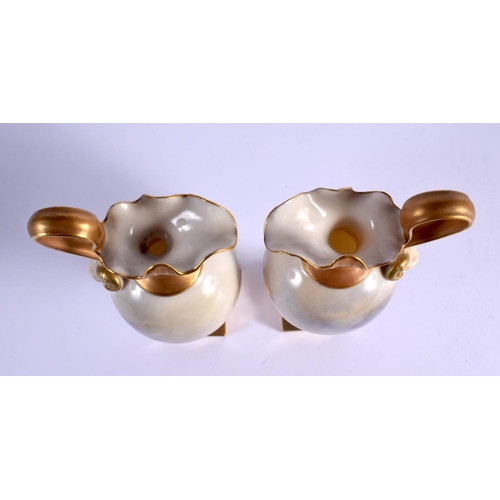 236 - A PAIR OF ROYAL WORCESTER PORCELAIN EWERS by Harry Stinton, painted with highland cattle. 17 cm high... 