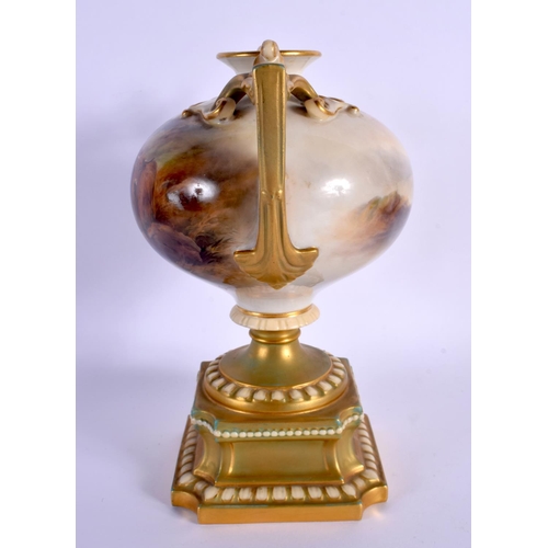 241 - AN UNUSUAL ROYAL WORCESTER TWIN HANDLED PORCELAIN VASE by Harry Stinton, painted with highland cattl... 