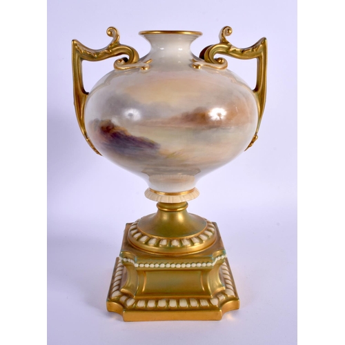 241 - AN UNUSUAL ROYAL WORCESTER TWIN HANDLED PORCELAIN VASE by Harry Stinton, painted with highland cattl... 