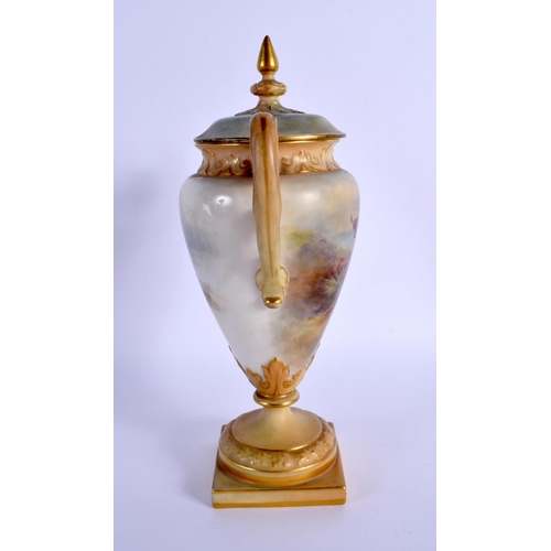 243 - A ROYAL WORCESTER TWIN HANDLED PORCELAIN VASE AND COVER by James Stinton, painted with highland catt... 