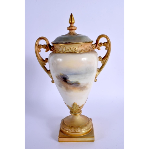 243 - A ROYAL WORCESTER TWIN HANDLED PORCELAIN VASE AND COVER by James Stinton, painted with highland catt... 