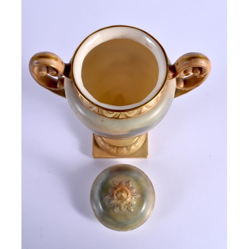 243 - A ROYAL WORCESTER TWIN HANDLED PORCELAIN VASE AND COVER by James Stinton, painted with highland catt... 