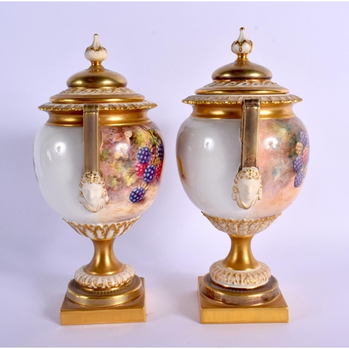 249 - A FINE PAIR OF TWIN HANDLED ROYAL WORCESTER VASES AND COVERS by Freeman, painted with fruit and berr... 