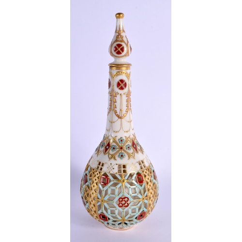 251 - AN AESTHETIC MOVEMENT RETICULATED ISLAMIC MARKET VASE AND COVER painted with jewelled motifs. 24 cm ... 