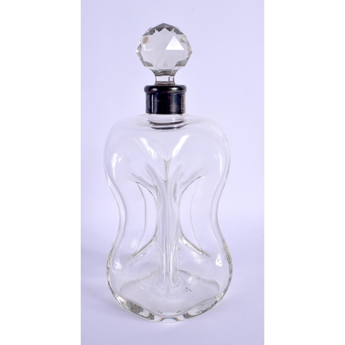 257 - AN ANTIQUE SILVER MOUNTED GLASS DECANTER. 19 cm high.