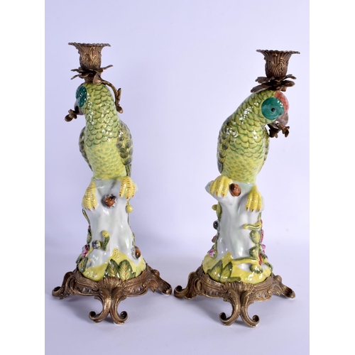 258 - A LARGE PAIR OF PORCELAIN PARROT CANDLESTICKS with French mounts. 36 cm high.