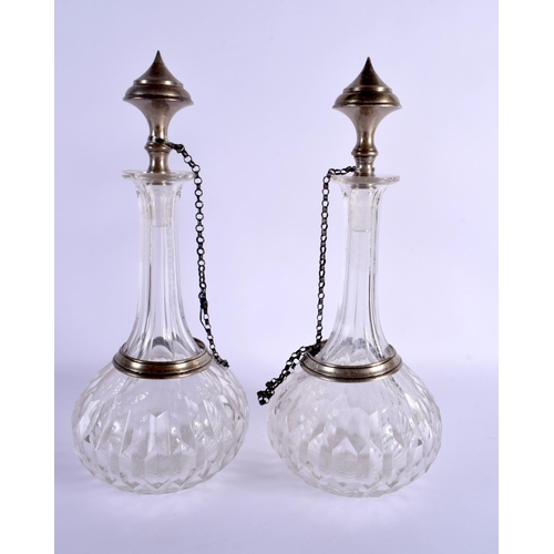 260 - A LARGE PAIR OF ANTIQUE CONTINENTAL TURKISH MARKET GLASS DECANTERS AND STOPPERS. 34 cm high.