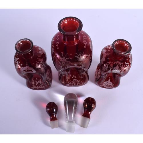261 - THREE BOHEMIAN GLASS VASES AND COVERS. Largest 27 cm high. (3)