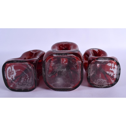 261 - THREE BOHEMIAN GLASS VASES AND COVERS. Largest 27 cm high. (3)