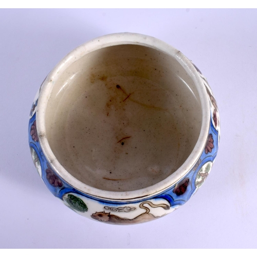 262 - A 19TH CENTURY ISLAMIC MIDDLE EASTERN QAJAR POTTERY BOWL painted with deer. 15 cm wide.