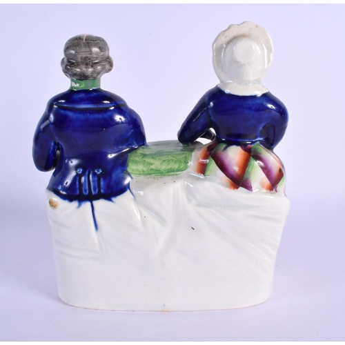 264 - AN UNUSUAL 19TH CENTURY STAFFORDSHIRE FIGURE modelled as a couple. 18 cm x 13 cm.
