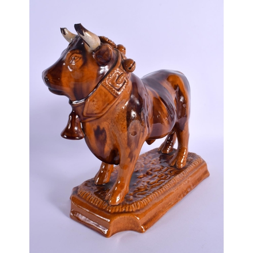 265 - A LARGE 19TH CENTURY EUROPEAN TREACLE GLAZED BULL DECANTER AND STOPPER. 25 cm x 18 cm.