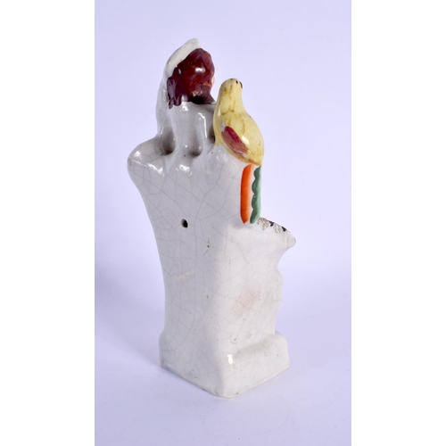 269 - A 19TH CENTURY STAFFORDSHIRE FIGURE OF A FEMALE modelled holding a bird. 18 cm x 6 cm.
