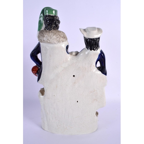 271 - A LARGE 19TH CENTURY STAFFORDSHIRE FIGURE OF A MALE AND FEMALE modelled with a dog and horn. 32 cm x... 