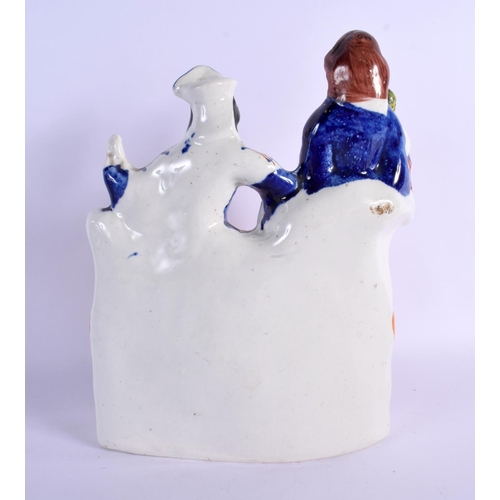 272 - A 19TH CENTURY STAFFORDSHIRE FIGURE OF A MALE AND FEMALE modelled holding an instrument and bird. 28... 