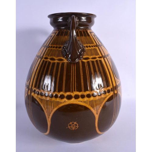 276 - A LARGE SECCESIONIST MOVEMENT TWIN HANDLED POTTERY VASE by Ault. 38 cm x 22 cm.