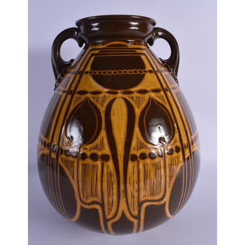 276 - A LARGE SECCESIONIST MOVEMENT TWIN HANDLED POTTERY VASE by Ault. 38 cm x 22 cm.