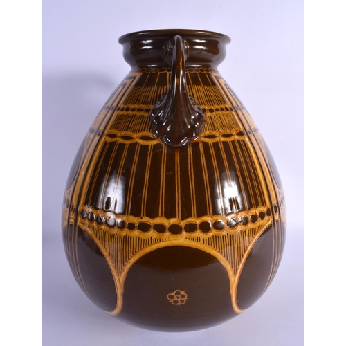 276 - A LARGE SECCESIONIST MOVEMENT TWIN HANDLED POTTERY VASE by Ault. 38 cm x 22 cm.