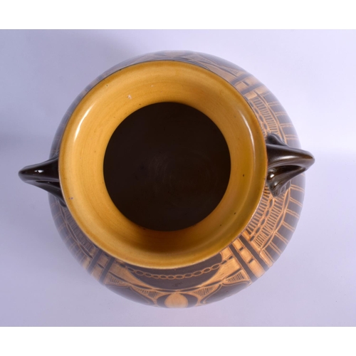 276 - A LARGE SECCESIONIST MOVEMENT TWIN HANDLED POTTERY VASE by Ault. 38 cm x 22 cm.