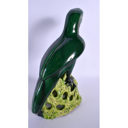 281 - A LARGE EARLY 20TH CENTURY CONTINENTAL POTTERY FIGURE OF A PARROT modelled upon a naturalistic stump... 