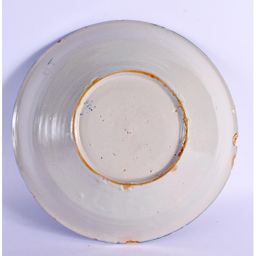 288 - A LARGE 18TH CENTURY DELFT BLUE AND WHITE TIN GLAZED BOWL painted with foliage. 23.5 cm diameter.