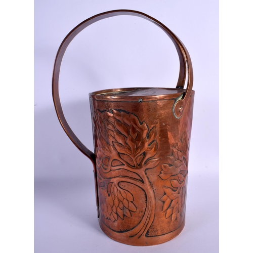 304 - AN ARTS AND CRAFTS COPPER JUG decorated in foliage. 34 cm x 18 cm.
