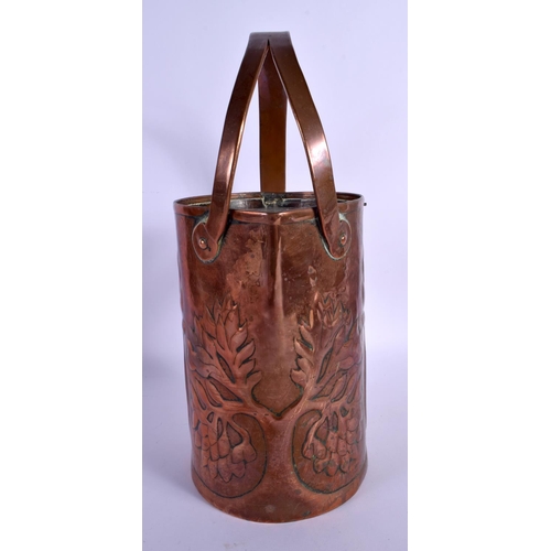 304 - AN ARTS AND CRAFTS COPPER JUG decorated in foliage. 34 cm x 18 cm.