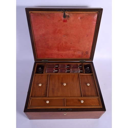 305 - A FINE EARLY VICTORIAN MAHOGANY AND SATINWOOD TRAVELLING VANITY BOX with fitted interior and scent b... 
