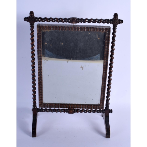 306 - AN UNUSUAL AESTHETIC MOVEMENT REVOLVING EMBROIDERED SCREEN with turned wood supports. 38 cm x 24 cm.