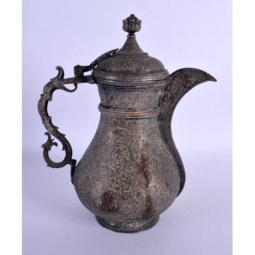 307 - A FINE 19TH CENTURY INDIAN MIDDLE EASTERN KUFIC MIXED METAL BRONZE EWER with silver overlay. 24 cm x... 